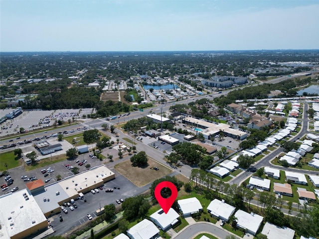 aerial view of property's location with a large body of water
