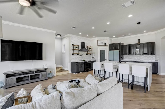 655 Whisper Woods Dr, Lakeland, FL 33813 - living area featuring ornamental molding, recessed lighting, visible vents, and ceiling fan
