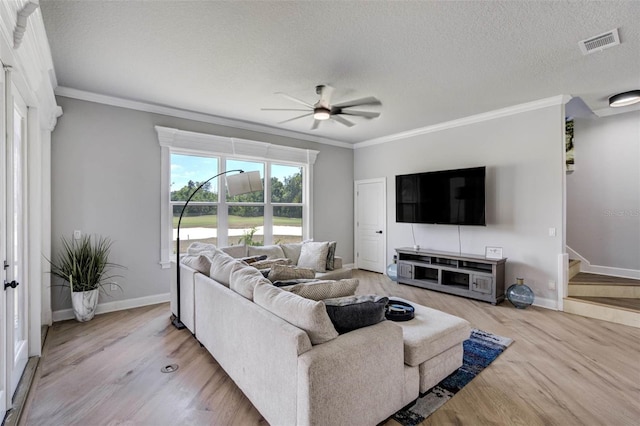655 Whisper Woods Dr, Lakeland, FL 33813 - living room with wood finished floors, visible vents, a ceiling fan, and baseboards