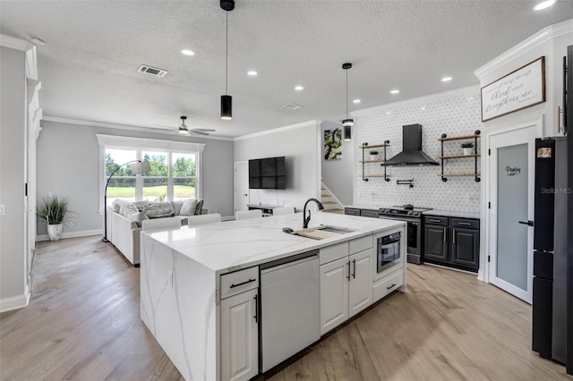 655 Whisper Woods Dr, Lakeland, FL 33813 - kitchen with crown molding, a sink, stainless steel range with electric stovetop, dishwasher, and wall chimney exhaust hood