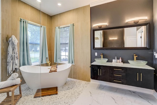 655 Whisper Woods Dr, Lakeland, FL 33813 - full bathroom with marble finish floor, a sink, a freestanding tub, and double vanity