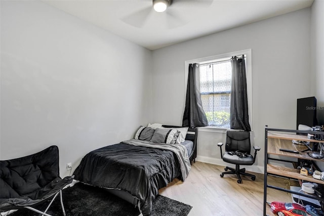 655 Whisper Woods Dr, Lakeland, FL 33813 - bedroom with light wood-style floors, ceiling fan, and baseboards