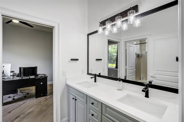 655 Whisper Woods Dr, Lakeland, FL 33813 - full bath featuring wood finished floors, a ceiling fan, walk in shower, and a sink