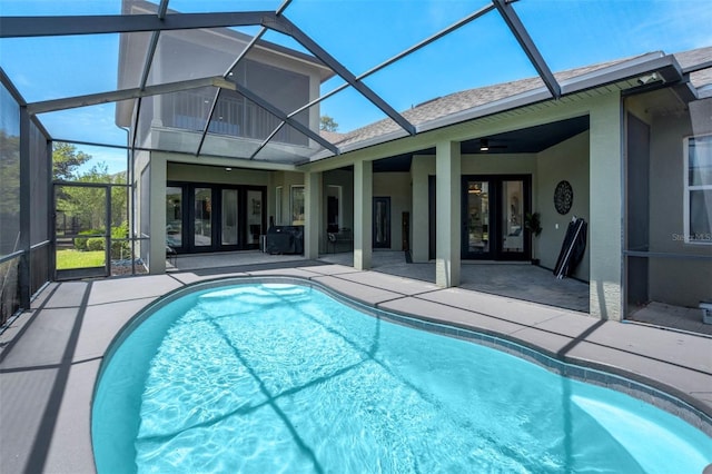 655 Whisper Woods Dr, Lakeland, FL 33813 - outdoor pool with a patio, glass enclosure, ceiling fan, and french doors