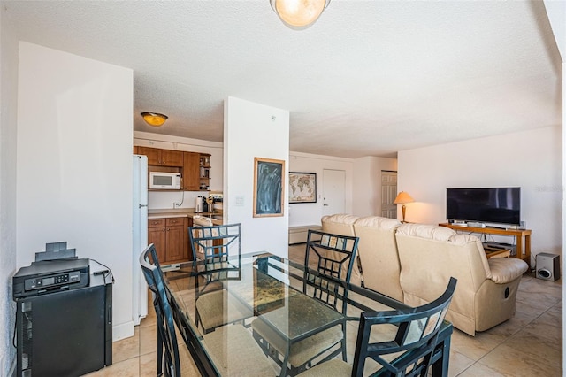 dining room featuring light tile patterned floors