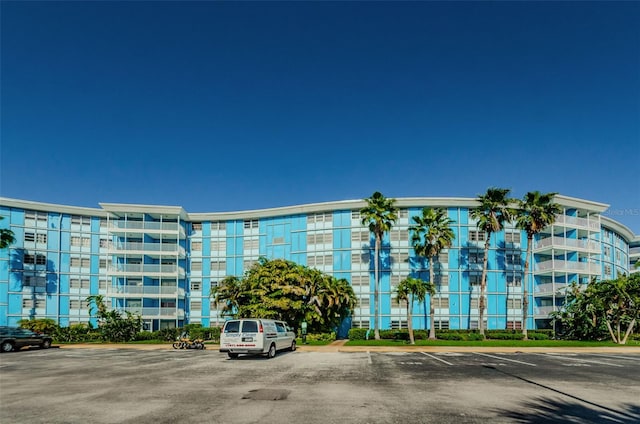 view of property with uncovered parking