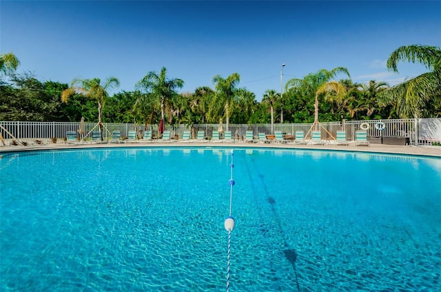 community pool featuring fence