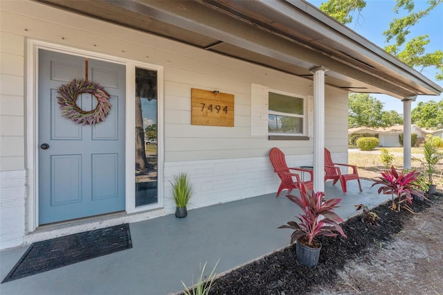 7494 7th St N, Saint Petersburg, FL 33702 - view of exterior entry with covered porch
