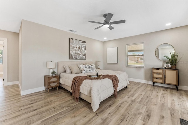 7494 7th St N, Saint Petersburg, FL 33702 - bedroom featuring baseboards, visible vents, multiple windows, and light wood-style floors