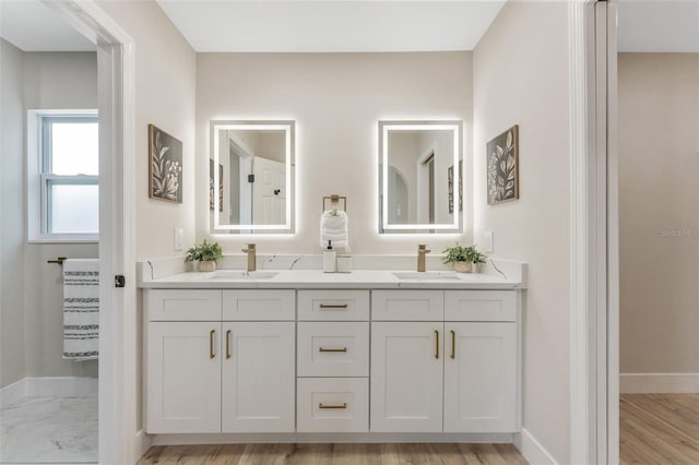 7494 7th St N, Saint Petersburg, FL 33702 - full bathroom featuring baseboards, a sink, and double vanity