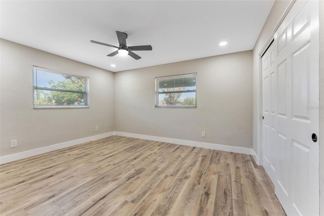 7494 7th St N, Saint Petersburg, FL 33702 - unfurnished bedroom featuring ceiling fan, baseboards, a closet, recessed lighting, and light wood-style flooring