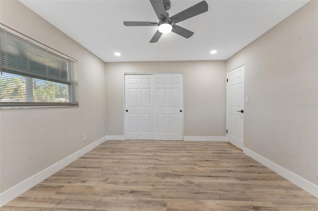 7494 7th St N, Saint Petersburg, FL 33702 - unfurnished bedroom with light wood finished floors, recessed lighting, baseboards, a ceiling fan, and a closet