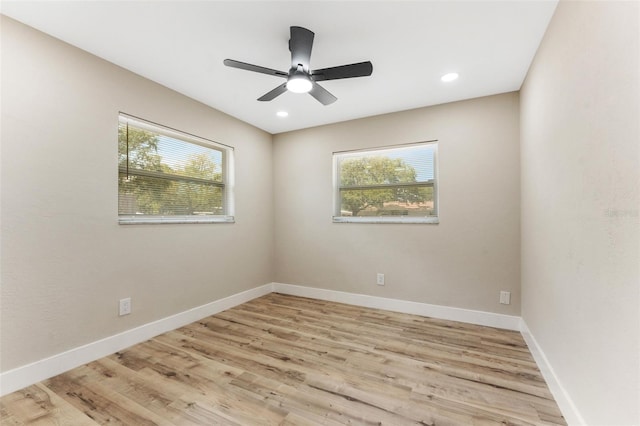 7494 7th St N, Saint Petersburg, FL 33702 - spare room featuring baseboards, ceiling fan, a wealth of natural light, and wood finished floors