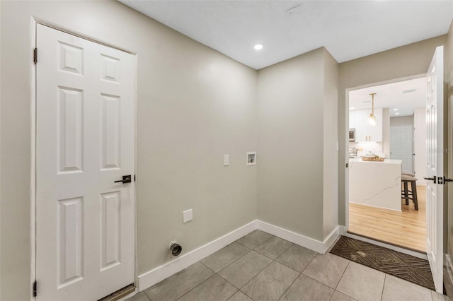 7494 7th St N, Saint Petersburg, FL 33702 - laundry room with laundry area, hookup for a washing machine, recessed lighting, baseboards, and light tile patterned floors