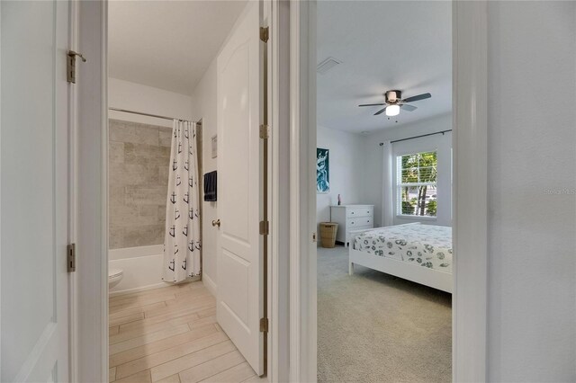 5814 Silver Sun Dr, Apollo Beach, FL 33572 - bedroom with connected bathroom and a ceiling fan