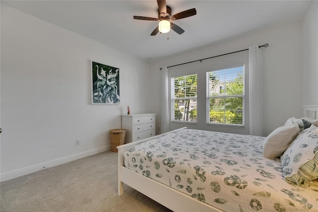 5814 Silver Sun Dr, Apollo Beach, FL 33572 - bedroom featuring baseboards, light carpet, and ceiling fan