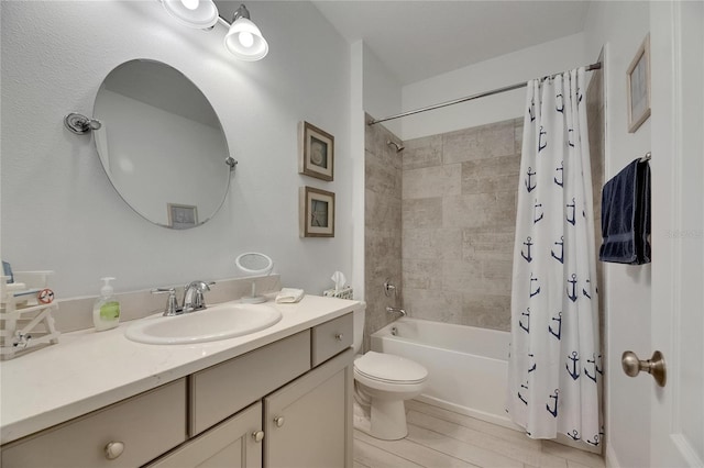 5814 Silver Sun Dr, Apollo Beach, FL 33572 - bathroom featuring vanity, shower / tub combo with curtain, and toilet