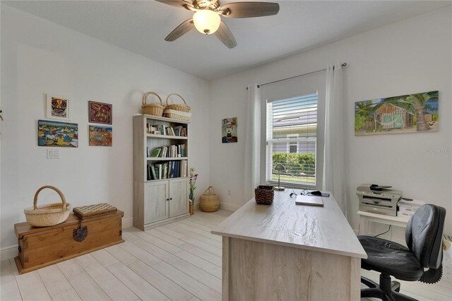 5814 Silver Sun Dr, Apollo Beach, FL 33572 - office featuring baseboards, a ceiling fan, and light wood-style floors