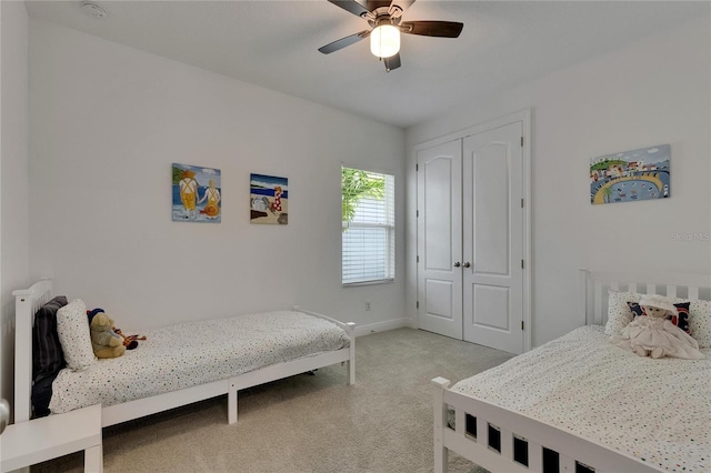 5814 Silver Sun Dr, Apollo Beach, FL 33572 - bedroom with light carpet, a closet, baseboards, and ceiling fan