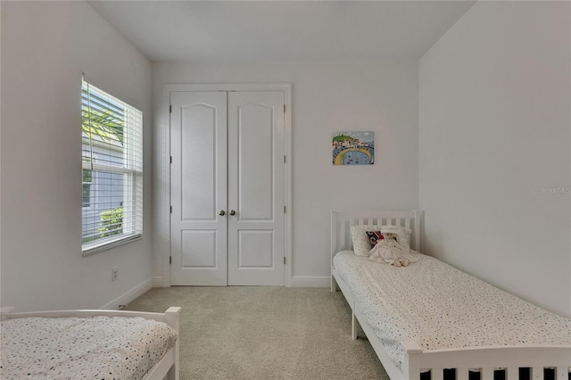 5814 Silver Sun Dr, Apollo Beach, FL 33572 - carpeted bedroom with multiple windows, baseboards, and a closet