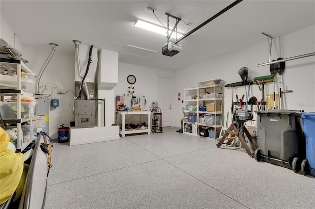 5814 Silver Sun Dr, Apollo Beach, FL 33572 - garage featuring water heater, a garage door opener, and heating unit