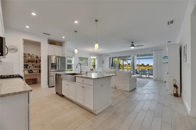 5814 Silver Sun Dr, Apollo Beach, FL 33572 - kitchen featuring a sink, stainless steel appliances, a ceiling fan, healthy amount of natural light, and recessed lighting