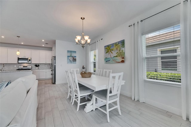 5814 Silver Sun Dr, Apollo Beach, FL 33572 - dining space featuring baseboards, a chandelier, light wood finished floors, and recessed lighting