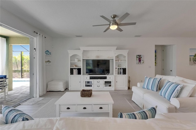 5814 Silver Sun Dr, Apollo Beach, FL 33572 - living room featuring ceiling fan and light wood-style floors