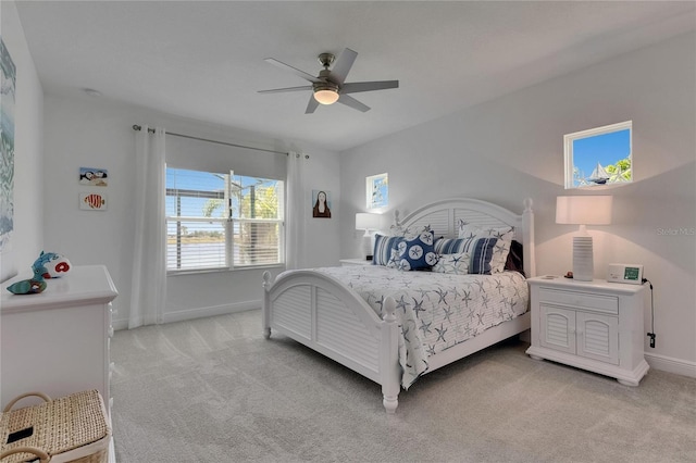 5814 Silver Sun Dr, Apollo Beach, FL 33572 - bedroom featuring light carpet, baseboards, and ceiling fan