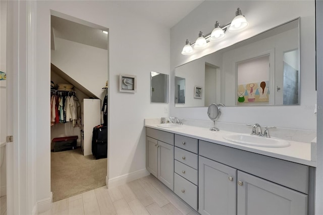 5814 Silver Sun Dr, Apollo Beach, FL 33572 - bathroom with double vanity and a walk in closet