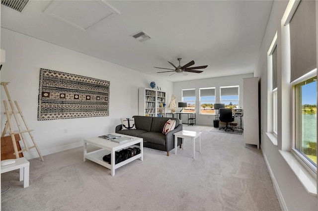 5814 Silver Sun Dr, Apollo Beach, FL 33572 - living area with an office area, carpet floors, plenty of natural light, and a ceiling fan