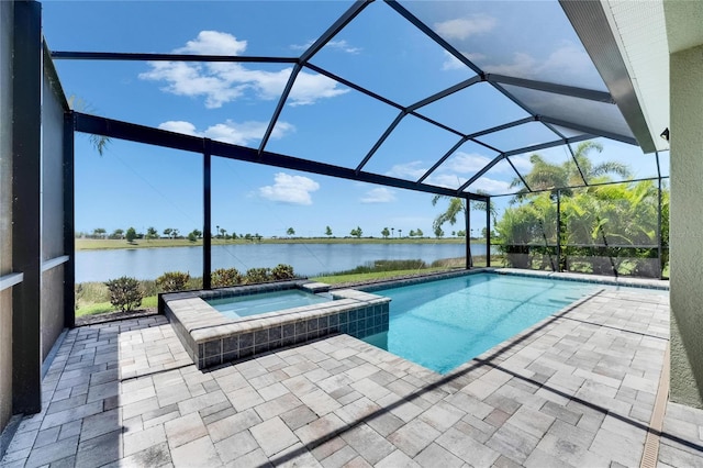 5814 Silver Sun Dr, Apollo Beach, FL 33572 - view of swimming pool with a water view, a patio, glass enclosure, and a pool with connected hot tub