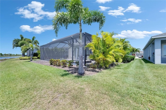 5814 Silver Sun Dr, Apollo Beach, FL 33572 - view of green lawn with glass enclosure and a water view