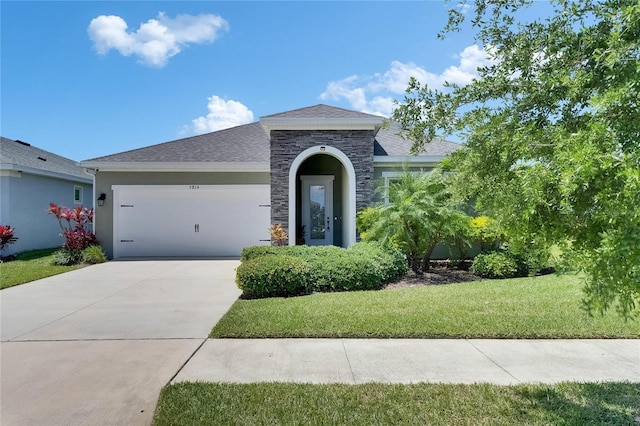 5814 Silver Sun Dr, Apollo Beach, FL 33572 - view of front facade featuring a garage, stone siding, a front lawn, driveway, and stucco siding