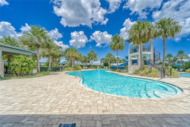 5814 Silver Sun Dr, Apollo Beach, FL 33572 - community pool with a patio area, a water slide, and stairs