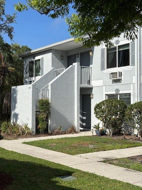 4127 Dolphin Dr Unit 4127, Tampa, FL 33617 - view of front of property with stucco siding