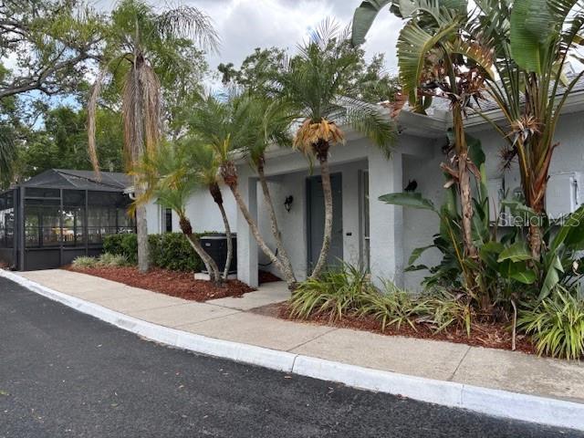 4127 Dolphin Dr Unit 4127, Tampa, FL 33617 - view of front facade featuring stucco siding and a porch