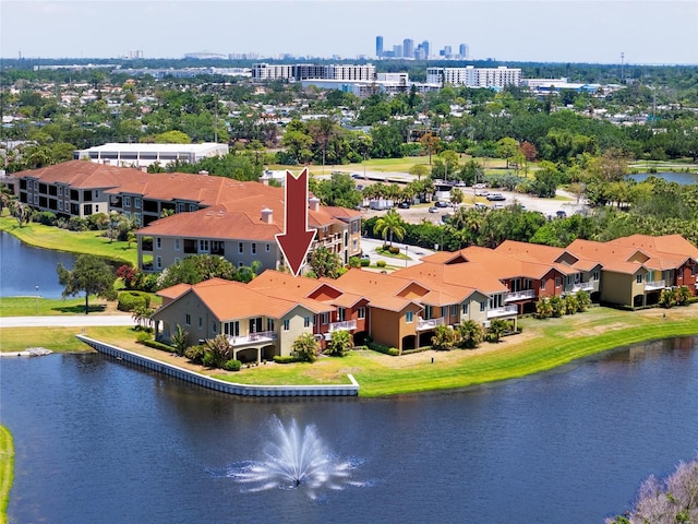 bird's eye view of a nearby body of water and a tree filled landscape