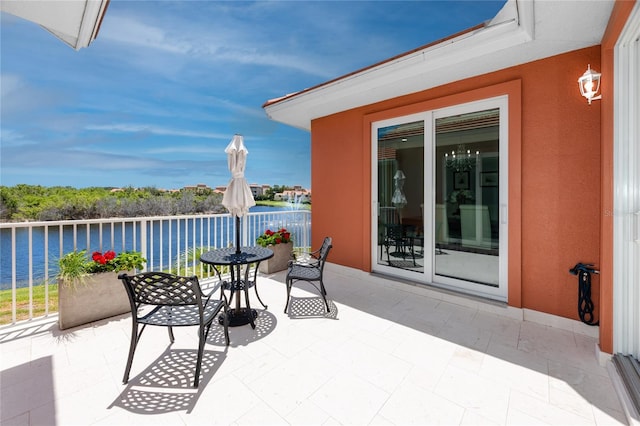 view of patio / terrace featuring a water view