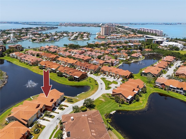 aerial perspective of suburban area with a nearby body of water