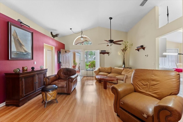 7235 Sharpsburg Blvd, New Port Richey, FL 34653 - living room featuring visible vents, light wood finished floors, ceiling fan, and high vaulted ceiling