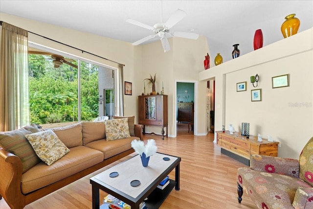 7235 Sharpsburg Blvd, New Port Richey, FL 34653 - living room featuring ceiling fan, high vaulted ceiling, and light wood-style floors