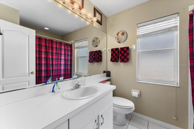 7235 Sharpsburg Blvd, New Port Richey, FL 34653 - full bath featuring toilet, plenty of natural light, tile patterned flooring, and vanity