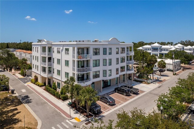 view of property featuring uncovered parking