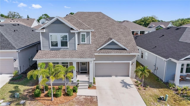 1432 Gopher Loop, Tarpon Springs, FL 34689 - traditional-style house with a porch, a residential view, concrete driveway, an attached garage, and a shingled roof