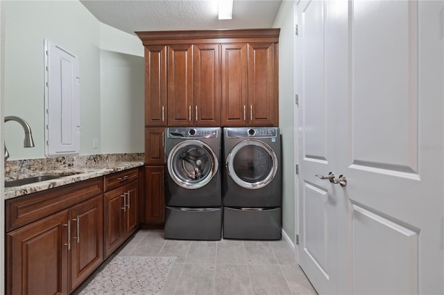 1432 Gopher Loop, Tarpon Springs, FL 34689 - laundry area with cabinet space, separate washer and dryer, and light tile patterned floors