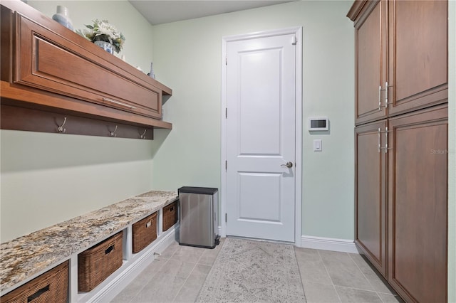 1432 Gopher Loop, Tarpon Springs, FL 34689 - mudroom featuring baseboards and light tile patterned floors
