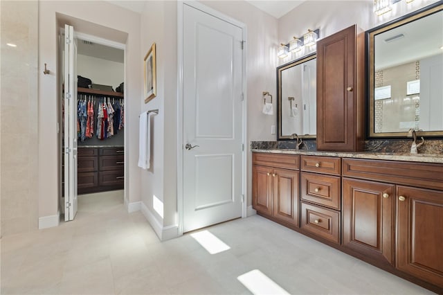 1432 Gopher Loop, Tarpon Springs, FL 34689 - bathroom with double vanity and a walk in closet