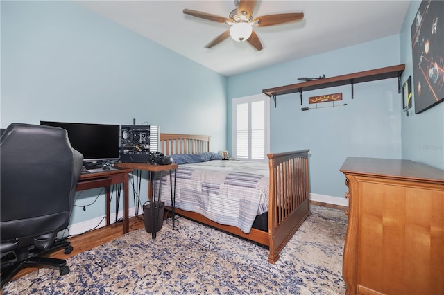 1432 Gopher Loop, Tarpon Springs, FL 34689 - bedroom featuring wood finished floors, a desk, baseboards, and a ceiling fan