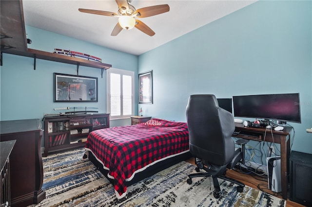 1432 Gopher Loop, Tarpon Springs, FL 34689 - bedroom featuring an office area, ceiling fan, and wood finished floors